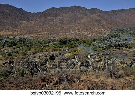 Stock Photography - "Epupa Falls, waterfalls of the Kunene River on the Namibian-Angolan border, Kunene Region, Namibia, Africa". Fotosearch
