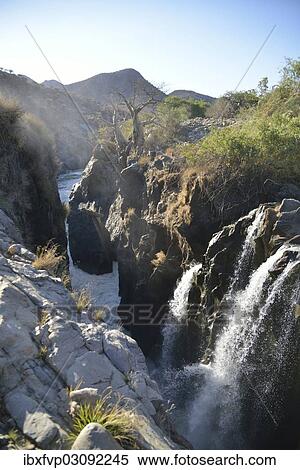 Stock Photography - "Epupa Falls, waterfalls of the Kunene River on the Namibian-Angolan border, Kunene Region, Namibia, Africa". Fotosearch