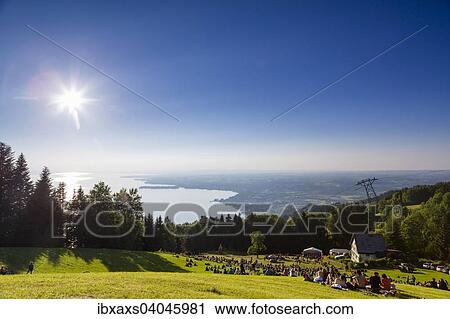 "Evening atmosphere on Mt Pfander, sommer soltice festival with views of Lake Constance, Bregenz, Vorarlberg, Austria, Europe" View Large Photo Image Stock Image - "Evening atmosphere on Mt Pfander, sommer soltice festival with views of Lake Constance, Bregenz, Vorarlberg, Austria, Europe". Fotosearch