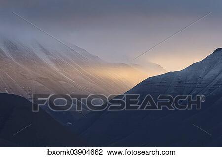 Stock Image - "Evening light in a valley, fjord, Isfjorden, Spitsbergen, Svalbard Islands, Svalbard and Jan Mayen, Norway, Europe". Fotosearch