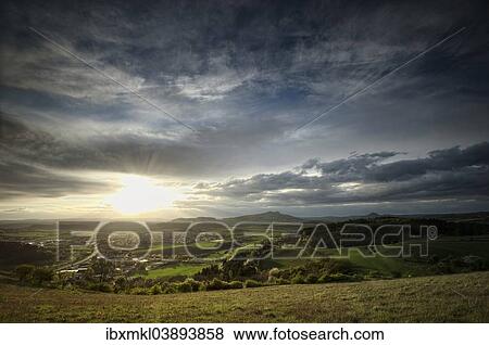 Stock Photo - "Evening mood in the volcanic landscape Hegau, with Mt Hohenstoffeln on the horizon, Baden-Wurttemberg, Germany, Europe". Fotosearch