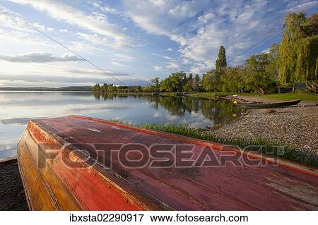 "Evening mood with reflections and boat on Reichenau Island on Lake Constance, Baden-Wuerttemberg, Germany, Europe" View Large Photo Image Stock Photo - "Evening mood with reflections and boat on Reichenau Island on Lake Constance, Baden-Wuerttemberg, Germany, Europe". Fotosearch