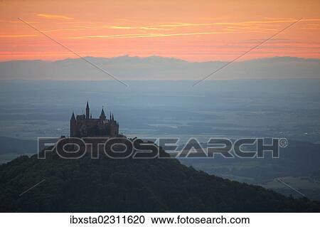 Stock Image - "Evening mood with the sunset near Burg Hohenzollern Castle, Swabian Alb, Baden-Wuerttemberg, Germany, Europe, PublicGround, Europe". Fotosearch