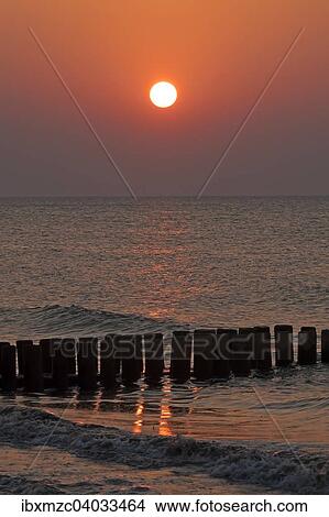 Picture - "Evening sun on the Baltic Sea, in front groin, Ahrenshoop, Darss, Mecklenburg-Western Pomerania, Germany, Europe". Fotosearch