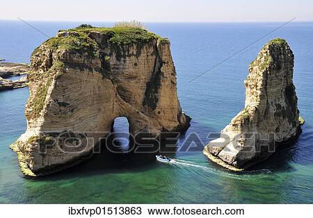 "Excursion boat off the Pigeons Rock, Grotte aux Pigeons, limestone rocks eroded by wind and weather in the Raouche district, Beirut, Lebanon, Middle East, Asia" View Large Photo Image Stock Image - "Excursion boat off the Pigeons Rock, Grotte aux Pigeons, limestone rocks eroded by wind and weather in the Raouche district, Beirut, Lebanon, Middle East, Asia". Fotosearch