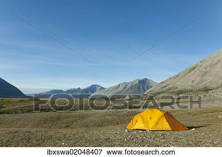 Stock Photo - "Expedition tent, arctic tundra, camping, Wind River and Mackenzie Mountains behind, Peel Watershed, Yukon Territory, Canada, North America". Fotosearch