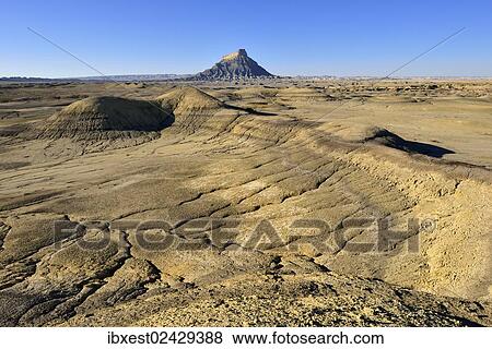 "Factory Butte in the bentonite hills of Caineville desert, Utah, USA, North America" View Large Photo Image Stock Photo - "Factory Butte in the bentonite hills of Caineville desert, Utah, USA, North America". Fotosearch