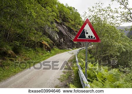 "Falling rocks warning sign by narrow mountain road, Hjolmo Valley, Norway, Europe" View Large Photo Image Stock Photograph - "Falling rocks warning sign by narrow mountain road, Hjolmo Valley, Norway, Europe". Fotosearch