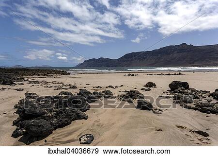 "Famara beach, Playa de Famara, in the back Risco de Famara, Lanzarote, Canary Islands, Spain, Europe" View Large Photo Image Stock Photo - "Famara beach, Playa de Famara, in the back Risco de Famara, Lanzarote, Canary Islands, Spain, Europe". Fotosearch