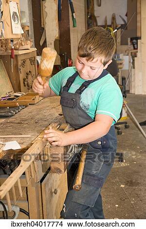 "Farmer's son repairing a hay rake, installation of new teeth, Sprenger family farm, Schwaz District Family, Tyrol, Austria, Europe" View Large Photo Image Picture - "Farmer's son repairing a hay rake, installation of new teeth, Sprenger family farm, Schwaz District Family, Tyrol, Austria, Europe". Fotosearch