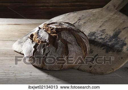 Farmhouse bread on an old bread slide View Large Photo Image Stock Image - Farmhouse bread on an old bread slide. Fotosearch