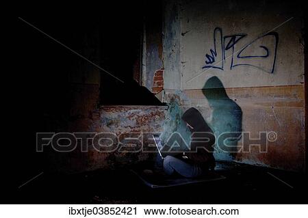 "Female computer hacker sitting with a laptop in the dark, in an old building" View Large Photo Image Stock Image - "Female computer hacker sitting with a laptop in the dark, in an old building". Fotosearch
