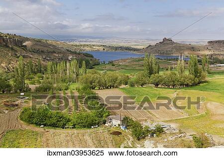 "Fields and Yuksek Kilise or High Church at Guzelyurt, Province Aksaray, Cappadocia, Central Anatolia Region, Anatolia, Turkey, Asia" View Large Photo Image Stock Photography - "Fields and Yuksek Kilise or High Church at Guzelyurt, Province Aksaray, Cappadocia, Central Anatolia Region, Anatolia, Turkey, Asia". Fotosearch