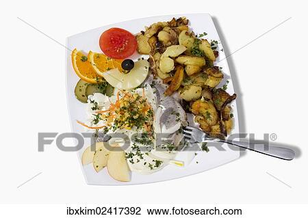 "Filets of herring with apples, onions and pineapple, yogurt dressing and fried potatoes" View Large Photo Image Stock Image - "Filets of herring with apples, onions and pineapple, yogurt dressing and fried potatoes". Fotosearch