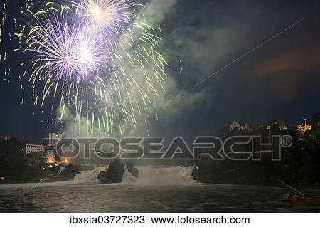 Stock Image - "Fireworks at the Rhine Falls during the Swiss National Day celebrations, Schaffhausen, Canton of Schaffhausen, Switzerland, Europe". Fotosearch
