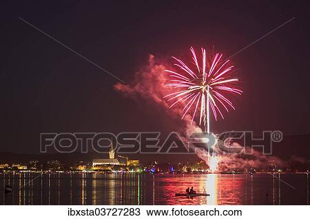 "Fireworks during the Hausherrenfest festival, couple on a floating island in Lake Constance at the front, Radolfzell, Baden-Wurttemberg, Germany, Europe" View Large Photo Image Stock Image - "Fireworks during the Hausherrenfest festival, couple on a floating island in Lake Constance at the front, Radolfzell, Baden-Wurttemberg, Germany, Europe". Fotosearch