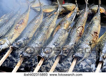 Stock Image - "Fish on skewers on grill, Ammerland, Lake Starnberg, Bavaria, Germany, Europe". Fotosearch