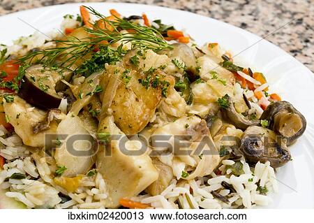 Stock Image - Fish stew with vegetables on rice. Fotosearch