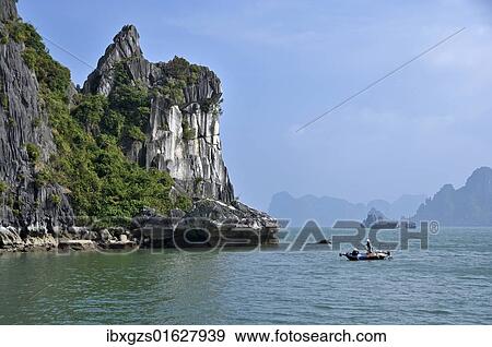 "Fisherman, boat in Halong Bay, Vietnam, Southeast Asia, Asia" View Large Photo Image Stock Photo - "Fisherman, boat in Halong Bay, Vietnam, Southeast Asia, Asia". Fotosearch