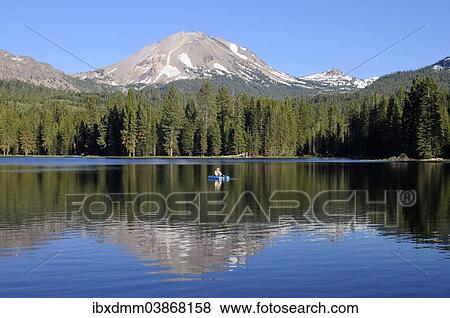 "Fishermen in a small boat on Manzanita Lake, behind the Lassen Peak volcano, Lassen Volcanic National Park, California, United States, North America" View Large Photo Image Stock Photo - "Fishermen in a small boat on Manzanita Lake, behind the Lassen Peak volcano, Lassen Volcanic National Park, California, United States, North America". Fotosearch