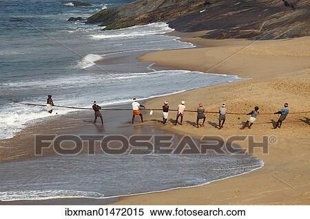 Stock Photography - "Fishermen pulling in a net, beach south of Kovalam, Malabar Coast, Malabar, Kerala, southern India, India, Asia". Fotosearch