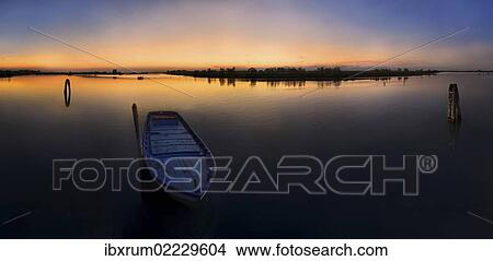 "Fishing boat at sunset in the lagoons of Cavallino, Venice, Italy, Europe" View Large Photo Image Picture - "Fishing boat at sunset in the lagoons of Cavallino, Venice, Italy, Europe". Fotosearch