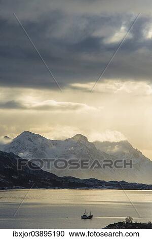 "Fishing boat on a fjord, Austnesfjorden fjord, Vagan, Lofoten, Norway, Europe" View Large Photo Image Stock Image - "Fishing boat on a fjord, Austnesfjorden fjord, Vagan, Lofoten, Norway, Europe". Fotosearch