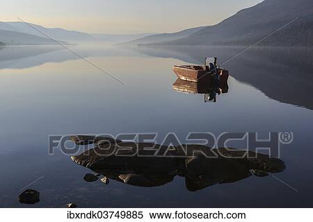 "Fishing boat on Loch Arkaig in the early morning, Fort William, Highlands, Scotland, United Kingdom, Europe" View Large Photo Image Stock Photography - "Fishing boat on Loch Arkaig in the early morning, Fort William, Highlands, Scotland, United Kingdom, Europe". Fotosearch