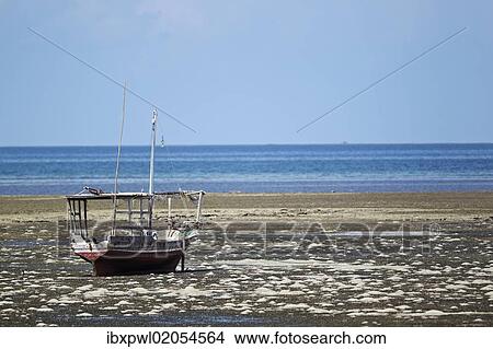 "Fishing boat on the beach at low tide, near Fumba, Zanzibar, Tanzania, Africa" View Large Photo Image Picture - "Fishing boat on the beach at low tide, near Fumba, Zanzibar, Tanzania, Africa". Fotosearch