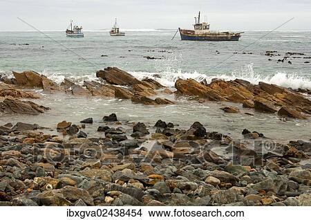 "Fishing boats in bad weather at sea off the coast of Port Nolloth, Northern Cape Province, South Africa, Africa" View Large Photo Image Picture - "Fishing boats in bad weather at sea off the coast of Port Nolloth, Northern Cape Province, South Africa, Africa". Fotosearch