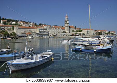 "Fishing boats in the harbour in front of the church of Sveti Ivan, St Ivan, Sutivan, Island of Brac, Dalmatia, Croatia, Europe" View Large Photo Image Stock Photo - "Fishing boats in the harbour in front of the church of Sveti Ivan, St Ivan, Sutivan, Island of Brac, Dalmatia, Croatia, Europe". Fotosearch