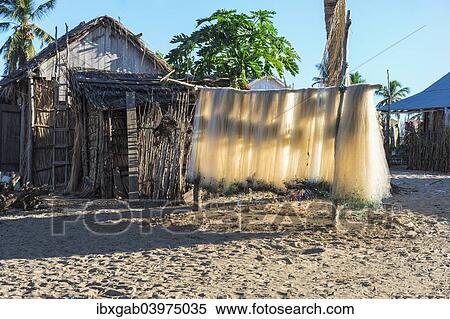 Stock Photography - "Fishing nets drying in the sun, Betany village, Morondava, Toliara province, Madagascar, Africa". Fotosearch