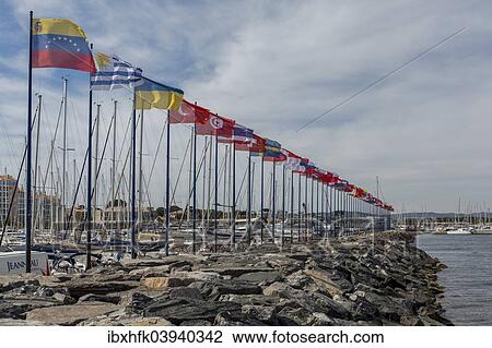"Flags decorating the sea wall at the yacht harbour, Hyeres, Departement Var, Provence-Alpes-Cote d’Azur, France, Europe" View Large Photo Image Stock Image - "Flags decorating the sea wall at the yacht harbour, Hyeres, Departement Var, Provence-Alpes-Cote d’Azur, France, Europe". Fotosearch