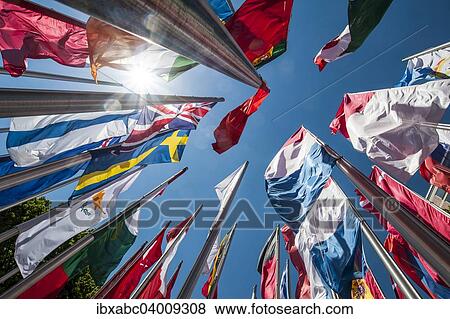 "Flags on steel masts, flying in the wind, Munich, Upper Bavaria, Bavaria, Germany, Europe" View Large Photo Image Stock Photo - "Flags on steel masts, flying in the wind, Munich, Upper Bavaria, Bavaria, Germany, Europe". Fotosearch