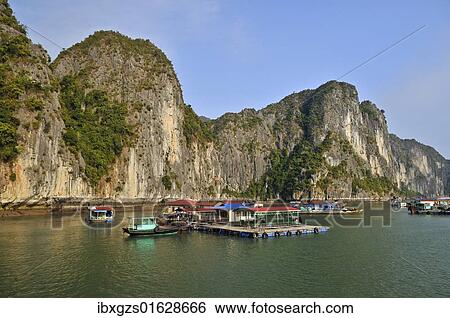 Stock Photograph - "Floating village, Halong Bay, Vietnam, Southeast Asia, Asia". Fotosearch