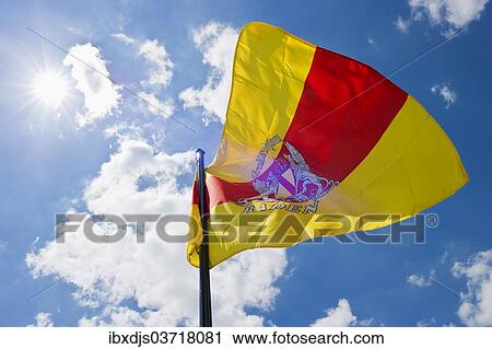 "Fluttering flag of Baden against a blue sky with sun, Germany, Europe" View Large Photo Image Stock Image - "Fluttering flag of Baden against a blue sky with sun, Germany, Europe". Fotosearch