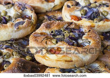 "Focaccia, Italian flat bread made from yeast yeast dough with herbs, tomatoes and olives" View Large Photo Image Stock Image - "Focaccia, Italian flat bread made from yeast yeast dough with herbs, tomatoes and olives". Fotosearch