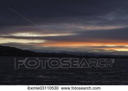 "Foehn clouds over Lake Pilsen with snow-covered alpine mountains, Pilsensee, near Seefeld, Upper Bavaria, Bavaria, Germany, Europe" View Large Photo Image Stock Image - "Foehn clouds over Lake Pilsen with snow-covered alpine mountains, Pilsensee, near Seefeld, Upper Bavaria, Bavaria, Germany, Europe". Fotosearch