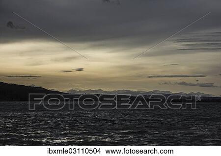 Picture - "Foehn mood over Lake Pilsen with mountain views in winter, Pilsensee, near Seefeld, Upper Bavaria, Bavaria, Germany, Europe". Fotosearch