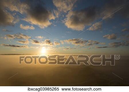 "Fog over dunes and heathland at sunrise, Henne, Region of Southern Denmark, Denmark, Europe" View Large Photo Image Stock Photography - "Fog over dunes and heathland at sunrise, Henne, Region of Southern Denmark, Denmark, Europe". Fotosearch