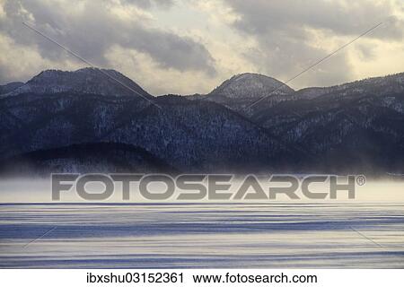 Stock Image - "Fog over the frozen Lake Kussharo, Akan-Nationalpark, Kawayu Onsen, Hokkaido, Japan, Asia". Fotosearch