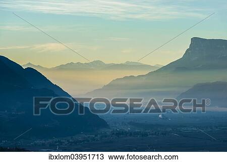 "Foggy sunrise in the valley of Merano, Trentino, Italy, Europe" View Large Photo Image Stock Image - "Foggy sunrise in the valley of Merano, Trentino, Italy, Europe". Fotosearch