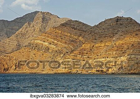 "Folded rocks as a result of geological processes, rock faces of the Khor Ash Sham Fjord, Musandam Governorate, Oman, Asia" View Large Photo Image Picture - "Folded rocks as a result of geological processes, rock faces of the Khor Ash Sham Fjord, Musandam Governorate, Oman, Asia". Fotosearch