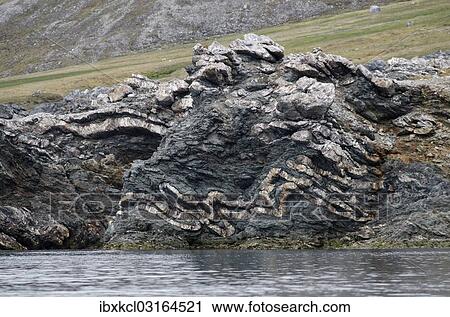 "Folding, folded rock strata, geological fold, Trygghamna, Isfjorden, Alkhornet, Spitsbergen Island, Svalbard Archipelago, Svalbard and Jan Mayen, Norway, Europe" View Large Photo Image Stock Image - "Folding, folded rock strata, geological fold, Trygghamna, Isfjorden, Alkhornet, Spitsbergen Island, Svalbard Archipelago, Svalbard and Jan Mayen, Norway, Europe". Fotosearch
