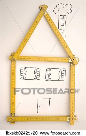 Stock Image - Folding rule in the shape of a house. Fotosearch
