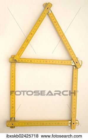 Stock Photo - Folding rule in the shape of a house. Fotosearch