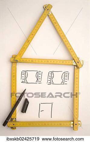 Stock Photo - Folding rule in the shape of a house. Fotosearch