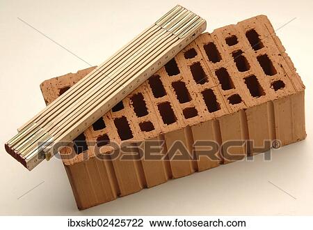 Folding rule lying on a red brick View Large Photo Image Stock Image - Folding rule lying on a red brick. Fotosearch