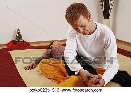 Foot massage by a Qigong coach View Large Photo Image Stock Image - Foot massage by a Qigong coach. Fotosearch