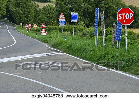 "Forest of traffic signs at a crossroads in the Val d'Orcia, Val d'Orcia, Province of Siena, Tuscany, Italy, Europe" View Large Photo Image Stock Photo - "Forest of traffic signs at a crossroads in the Val d'Orcia, Val d'Orcia, Province of Siena, Tuscany, Italy, Europe". Fotosearch